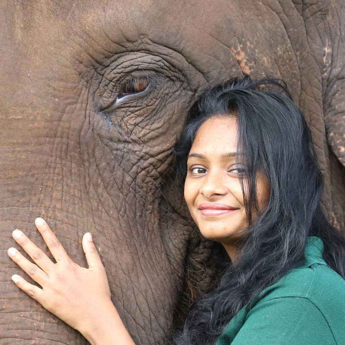 closed up of Dr. Kalani posing with an asian elephant